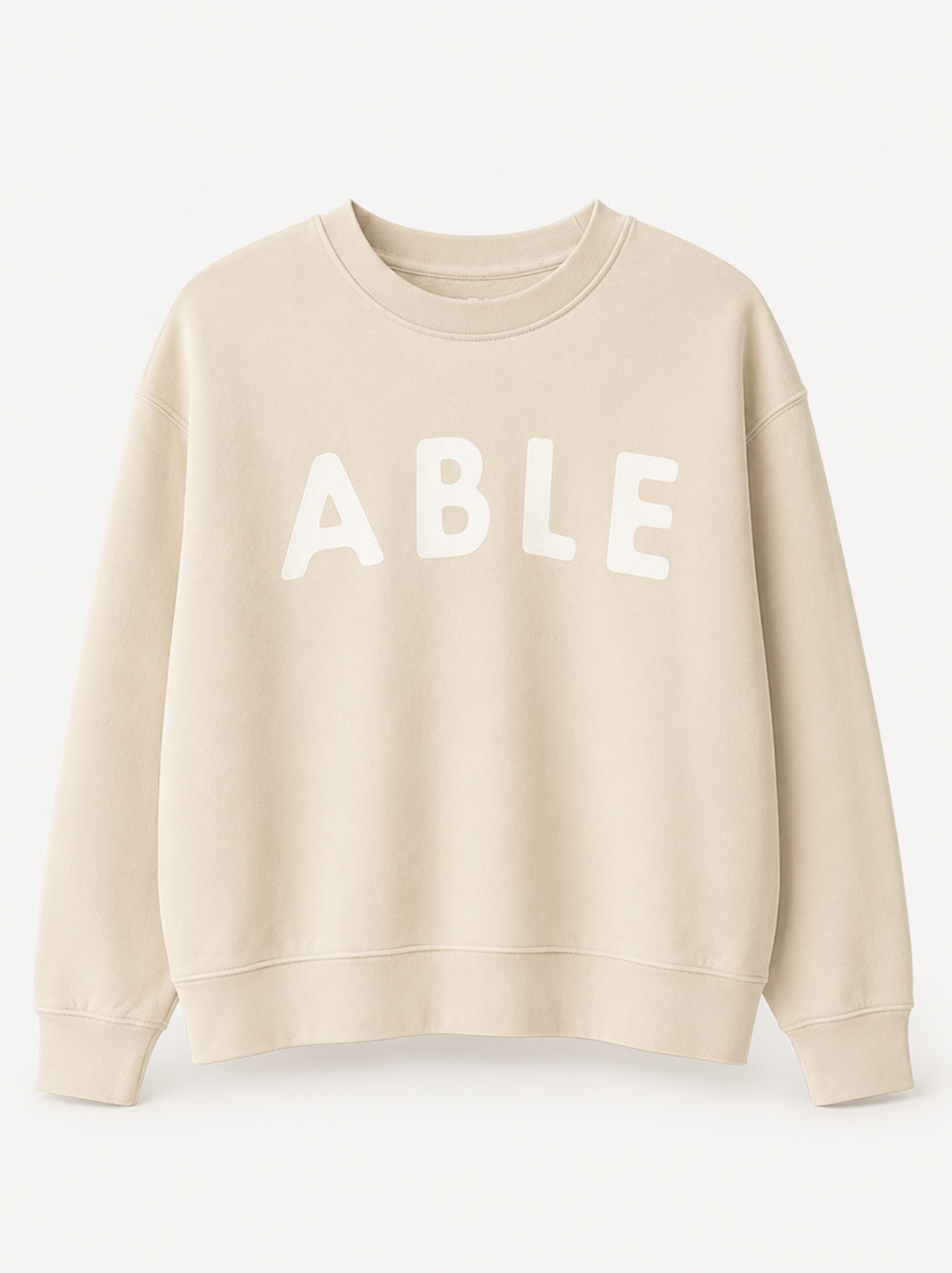 A cream-colored crewneck sweatshirt with the word 'ABLE' printed in large white letters across the chest, displayed on a clean white background.