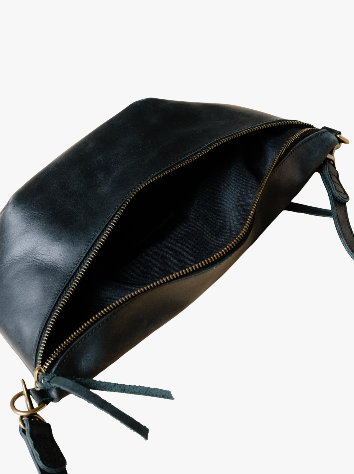 A black leather belt bag shown open, revealing its interior and a gold-tone zipper. The pouch has a matching black leather strap and a gold-tone metal ring clasp, photographed against a clean white background. #Color_Black
