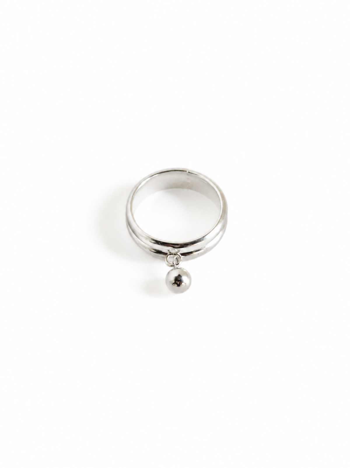 Silver ring with a small ball pendant on a white background