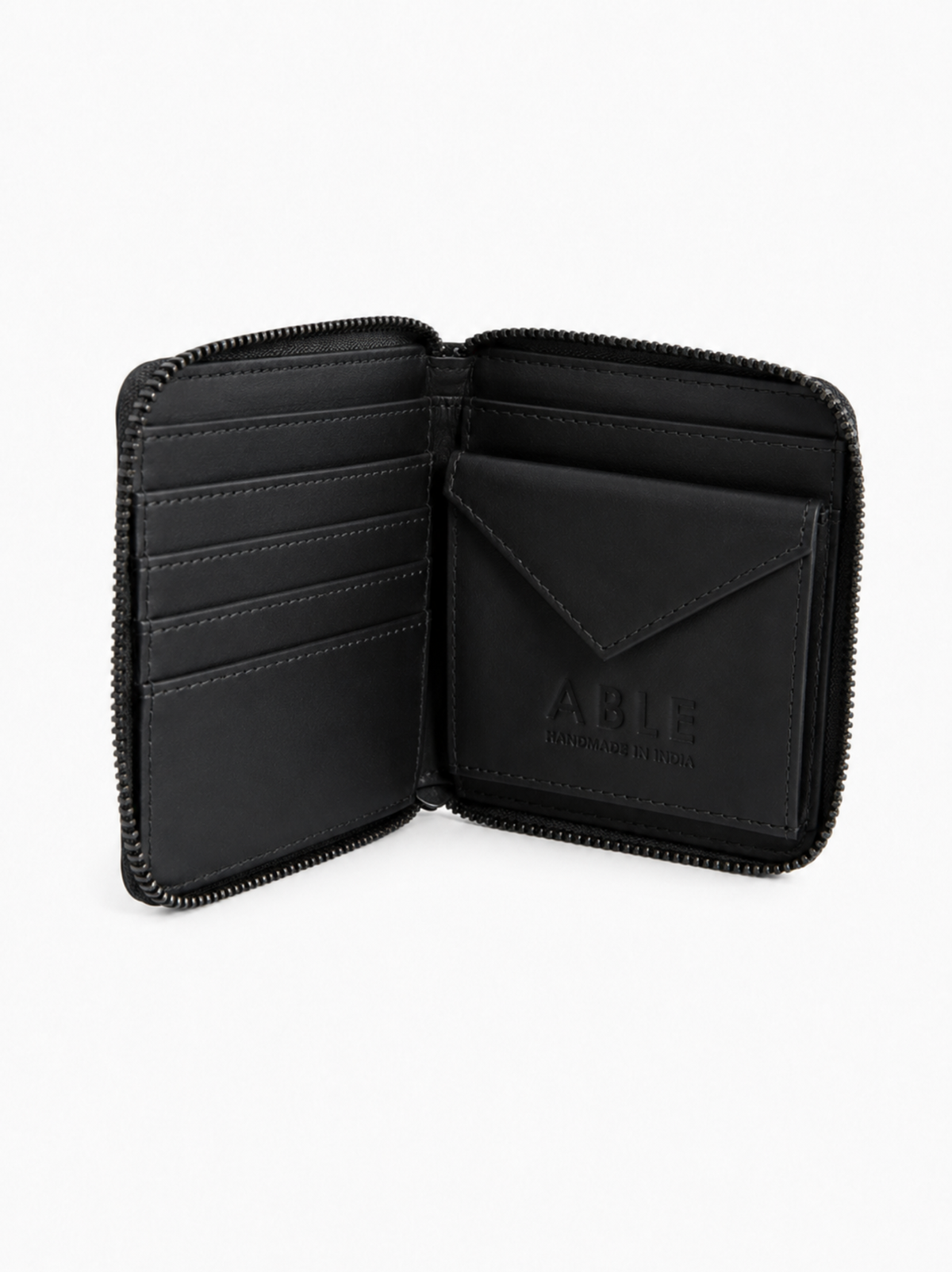 An open black zip-around wallet with multiple card slots and an envelope-style card holder, shown on a clean white background. The brand name 'ABLE' is embossed on the interior card holder. #Color_Black