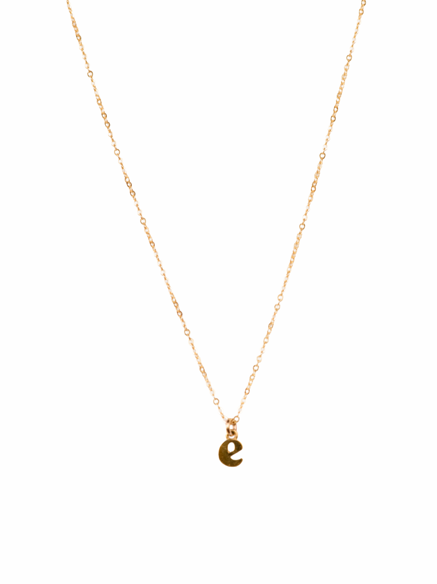 A delicate gold chain necklace featuring a small, polished lowercase letter 'e' pendant, presented on a solid white background.
