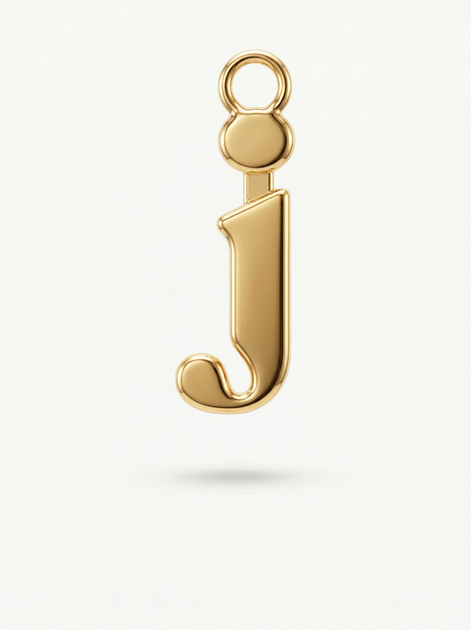 Initial Charm Gold Vermeil; Gold letter 'j' charm on a white background