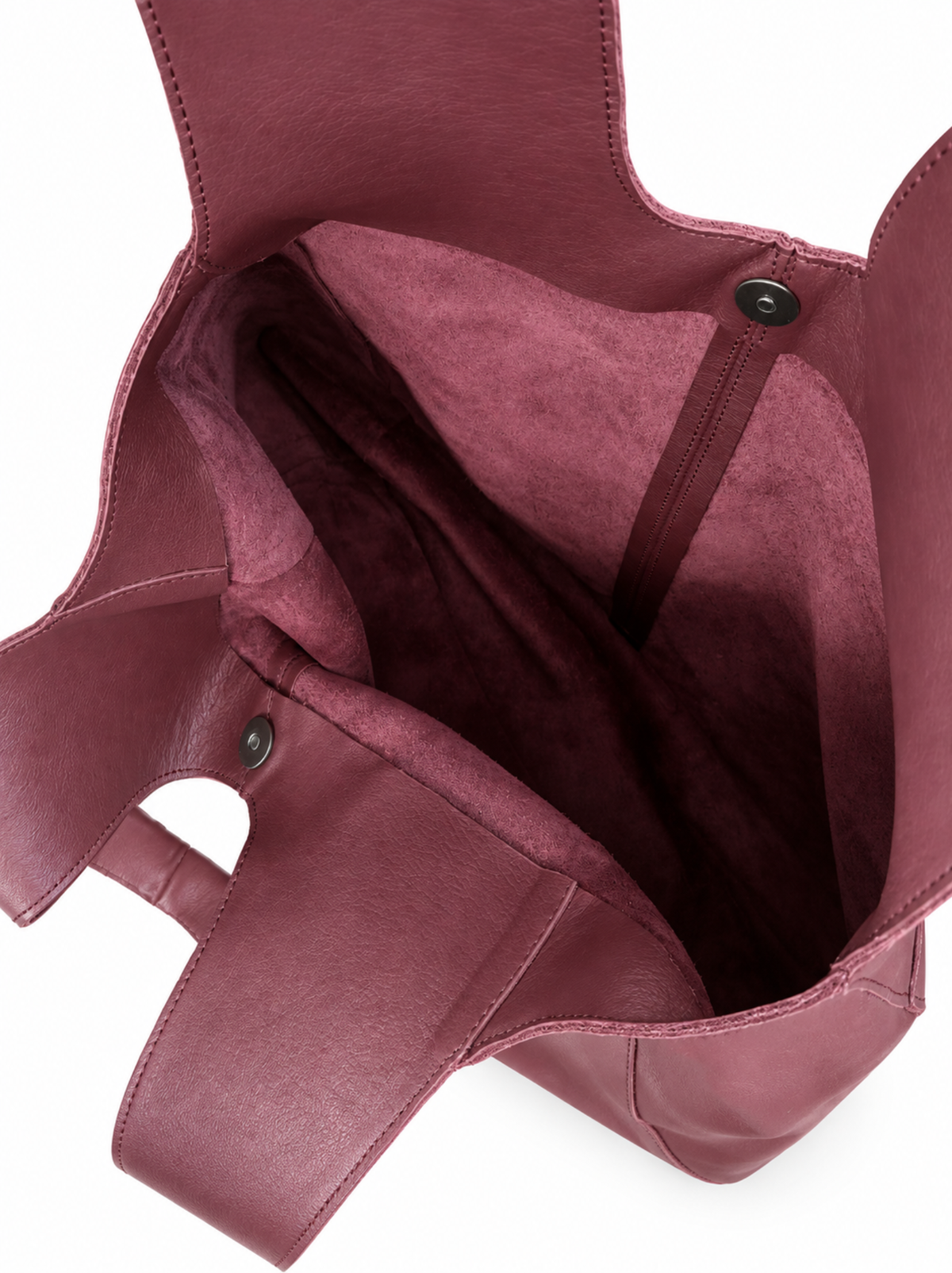 Close-up of the interior of a deep burgundy leather tote bag, showing the snap-magnetic closure against a white background. #Color_Oxblood