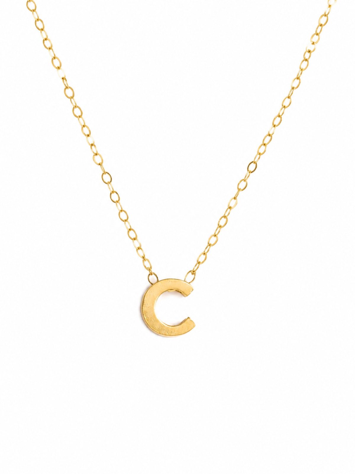 Letter Necklace with a single initial pendant in letter 'C' on a delicate gold chain placed on a white background.
