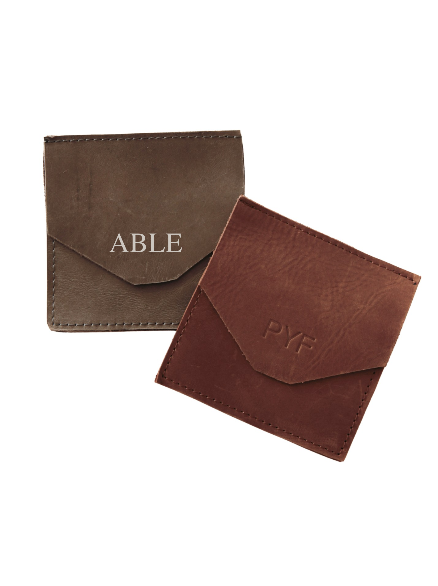 Two Lita Leather Envelope with 'ABLE' and 'PYF' embossed on a white background