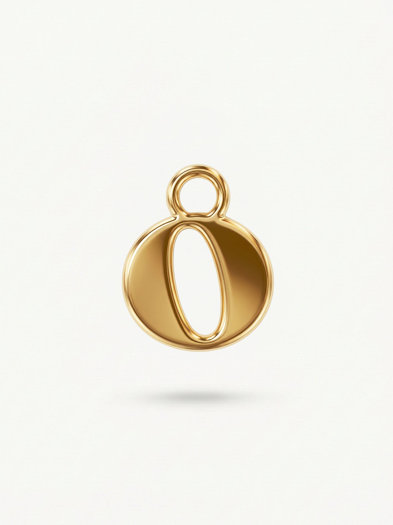 Initial Charm Gold Vermeil; Gold pendant shaped letter 'O' on a light background