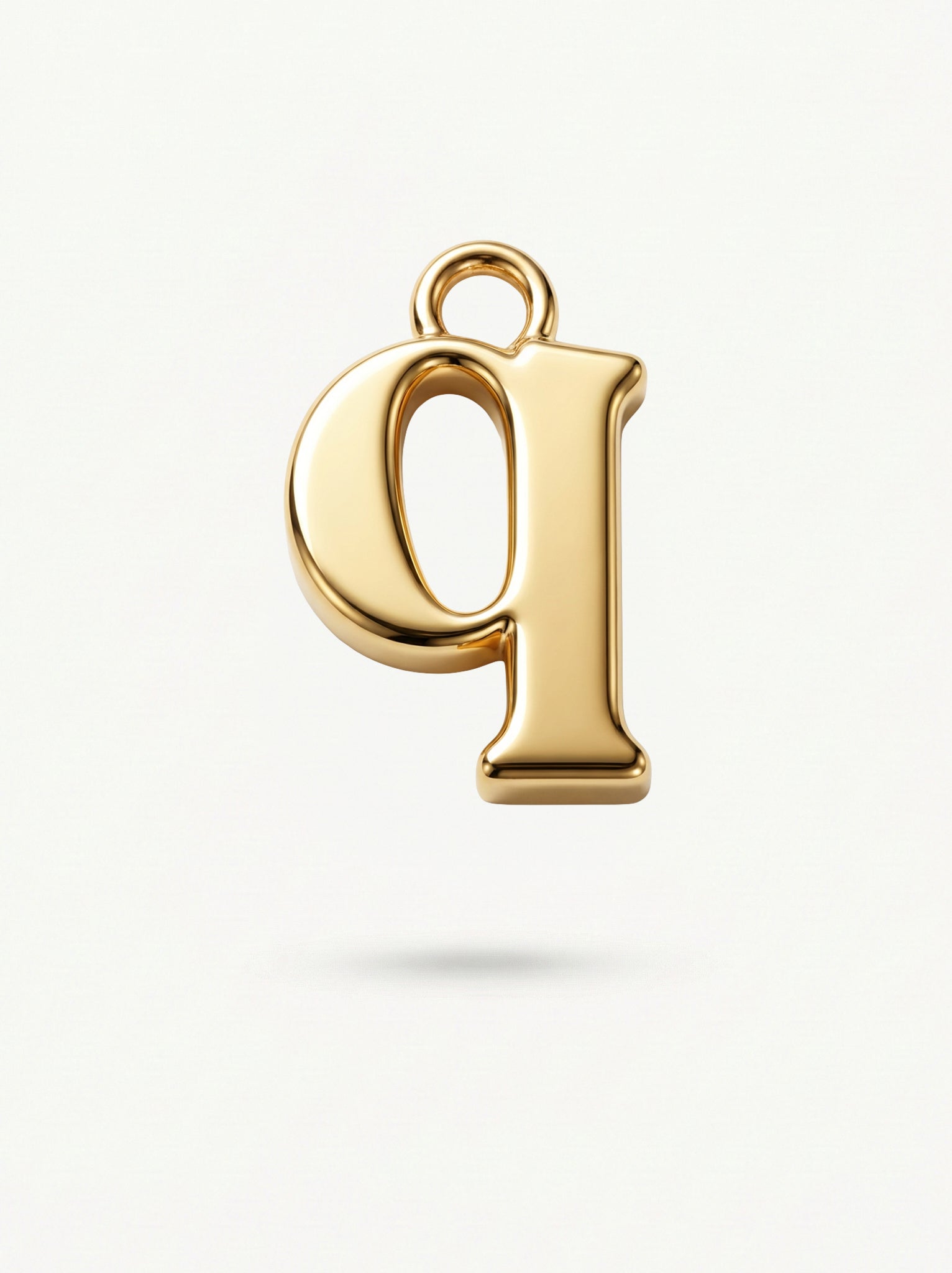 Initial Charm Gold Vermeil; Gold letter 'Q' pendant on a light background