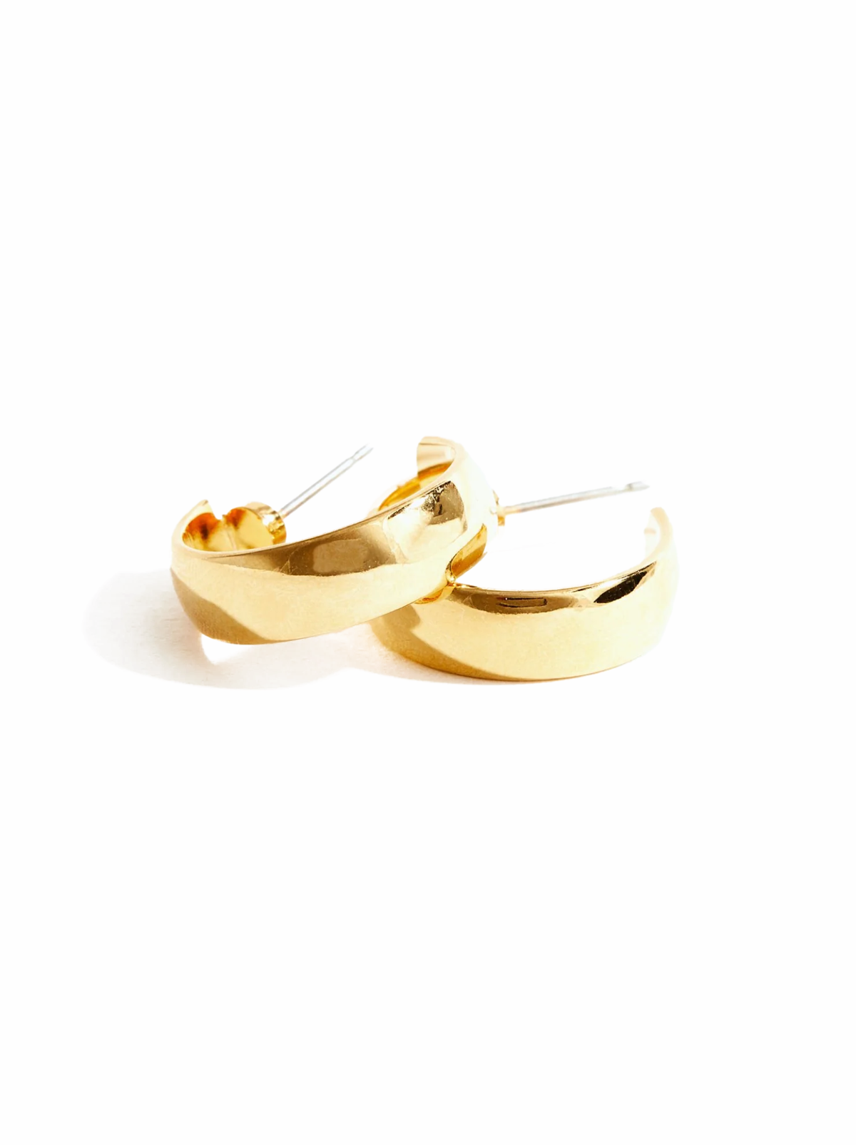 A pair of gold-plated brass hoop earrings with sterling silver posts and backs, displayed against a white background.