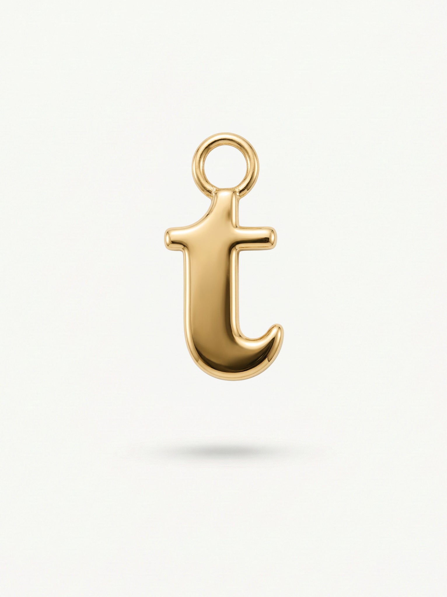 Initial Charm Gold Vermeil; Gold letter 't' pendant on a white background