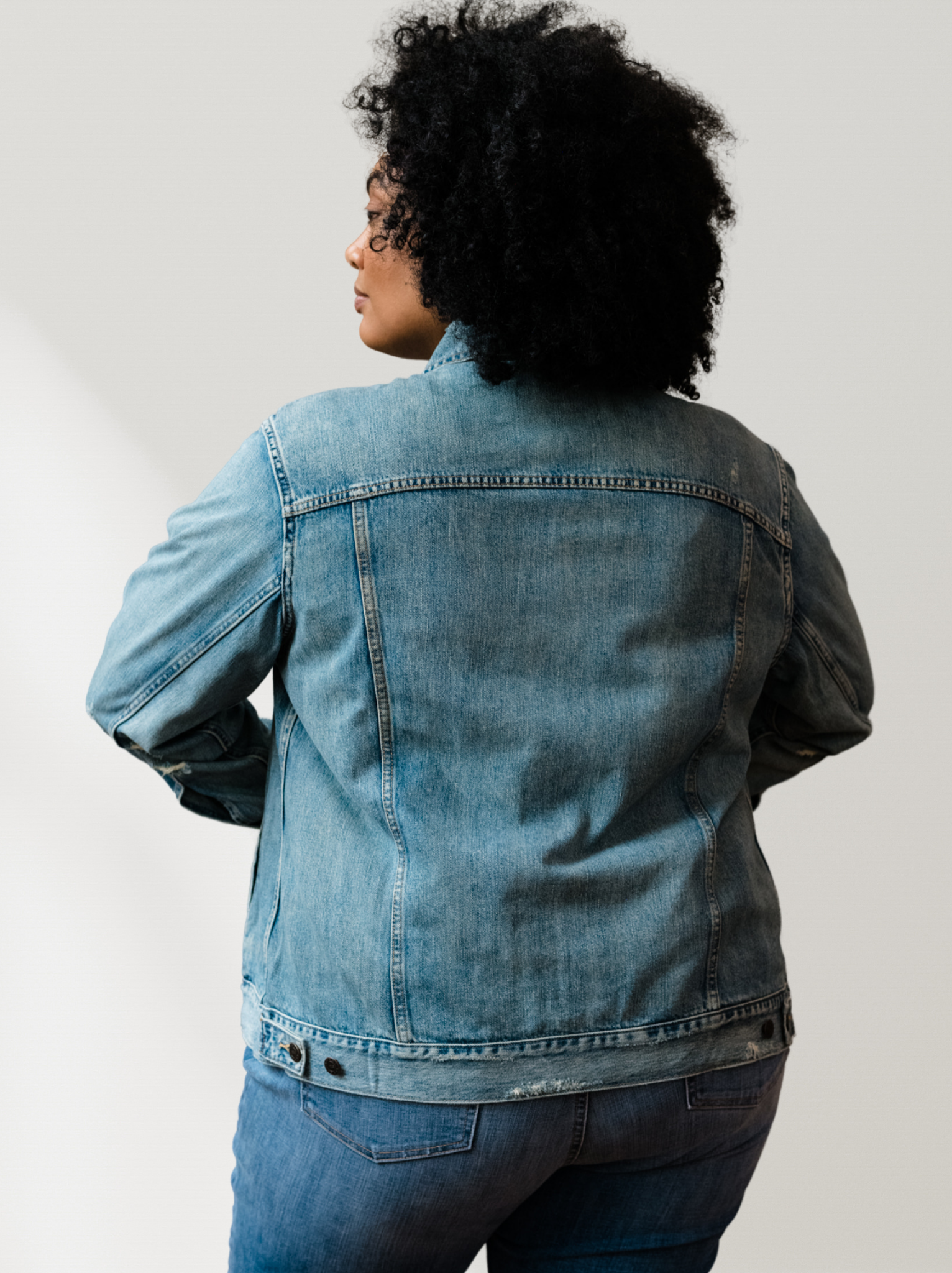 Person wearing The Merly Jacket from behind on a plain background