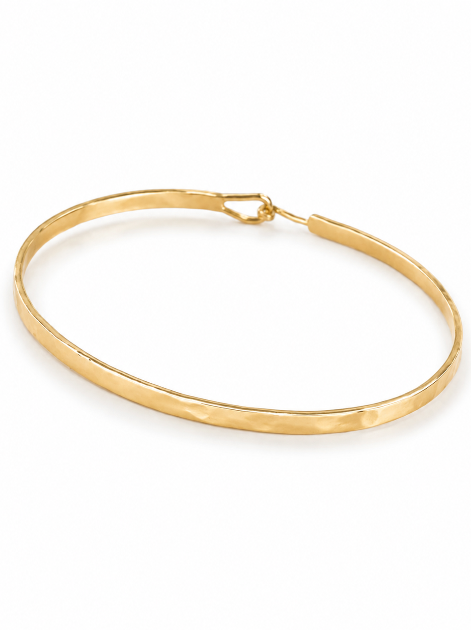 Hammered textured gold bangle with hook-and-eye closure on a white background.