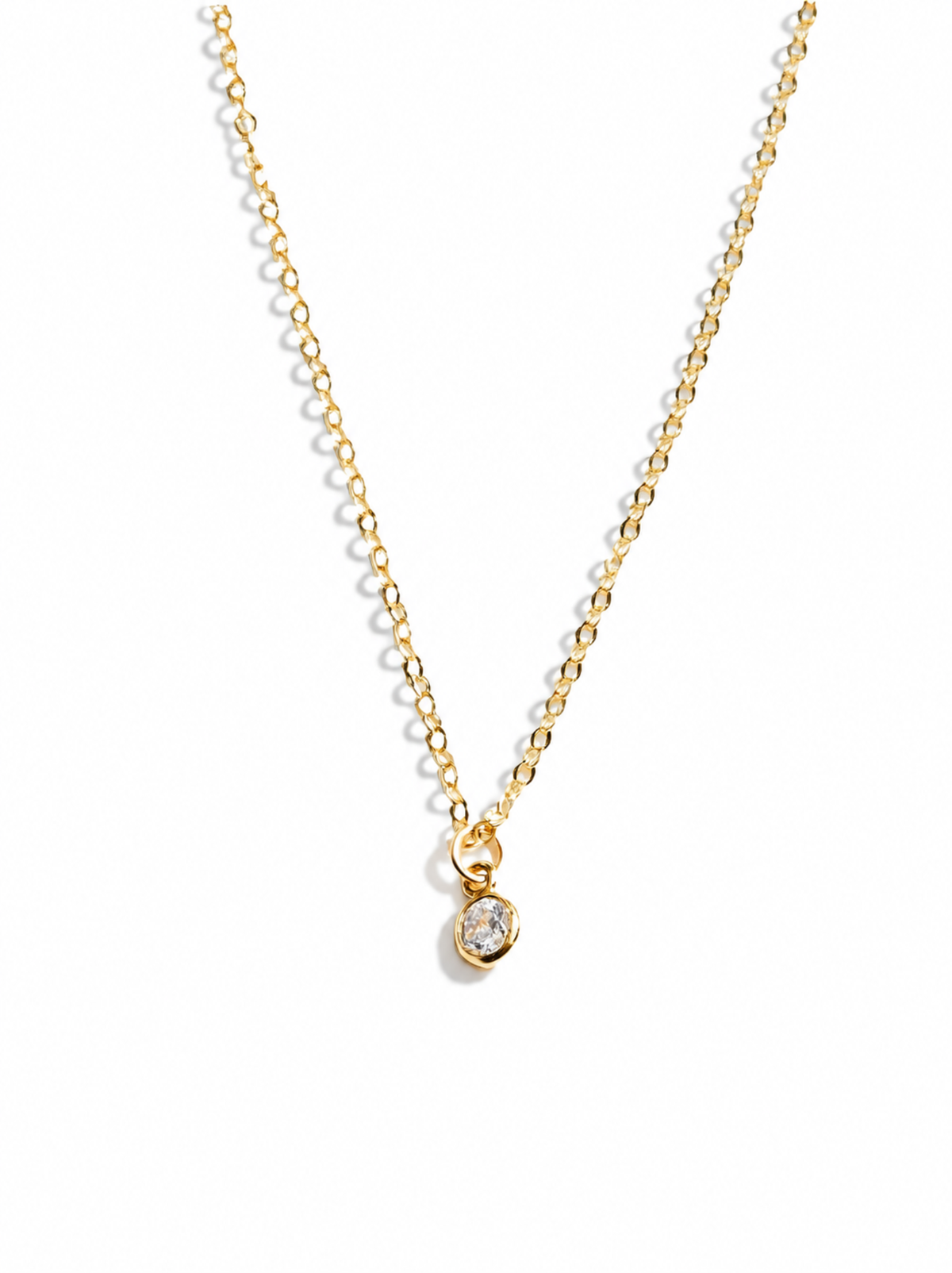 A dainty gold chain necklace with a single gold-filled cubic zirconia charm pendant, displayed against a white background.
