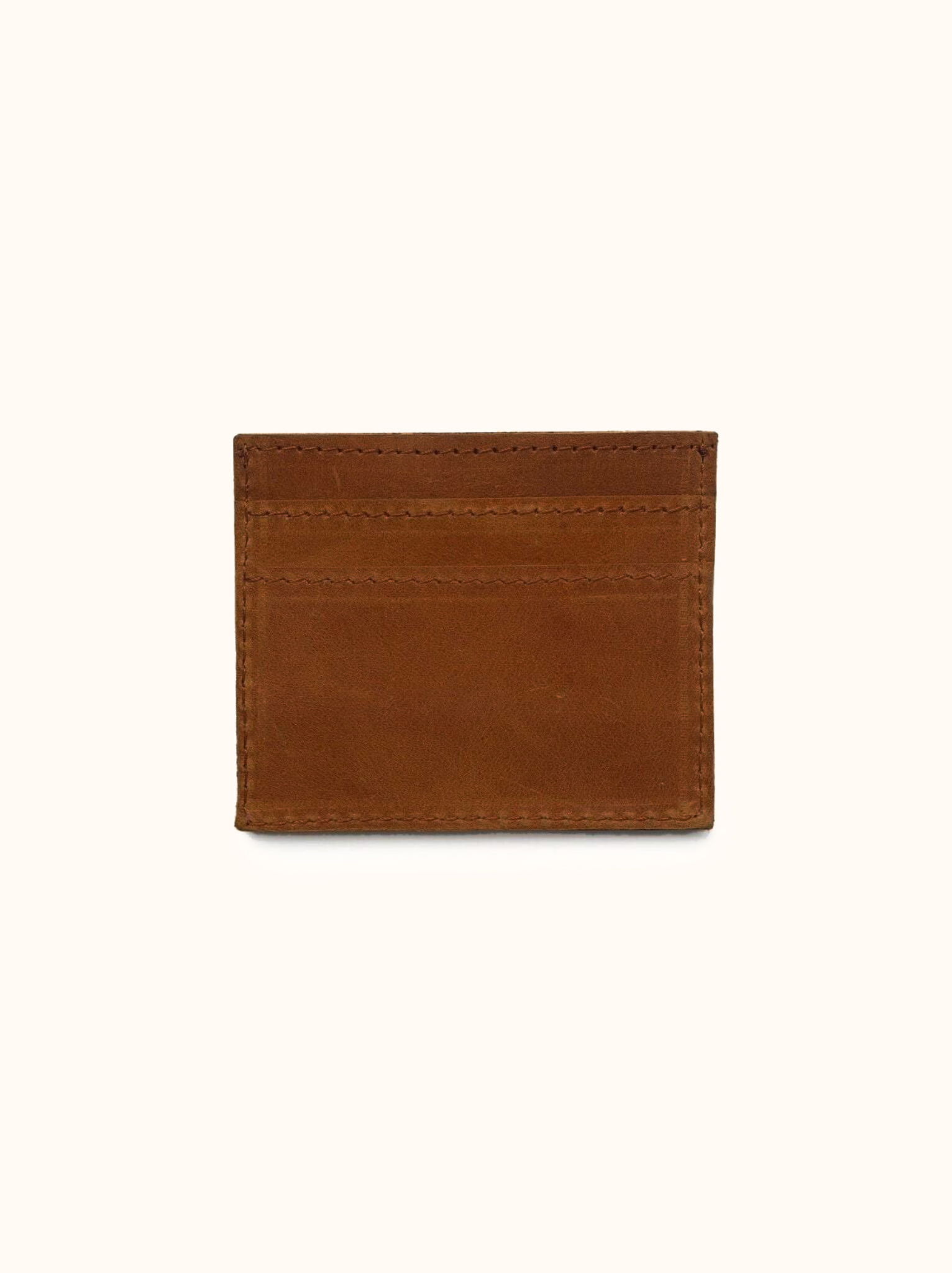 Alem Card Case; brown leather card case with multiple card slots and a center slot for cash. #Color_Whiskey