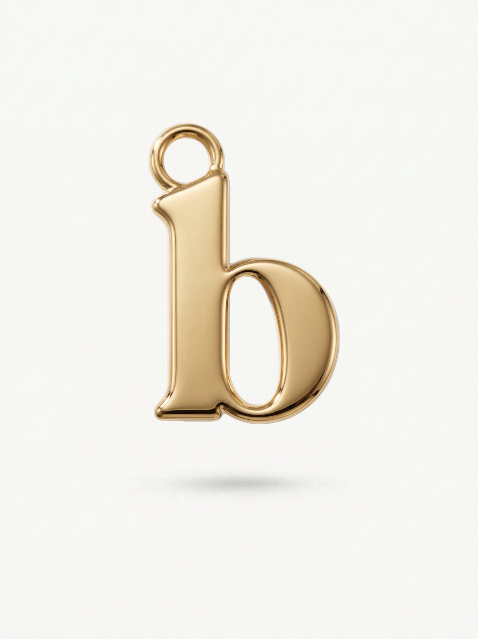 Initial Charm Gold Vermeil; Gold letter 'b' pendant on a white background