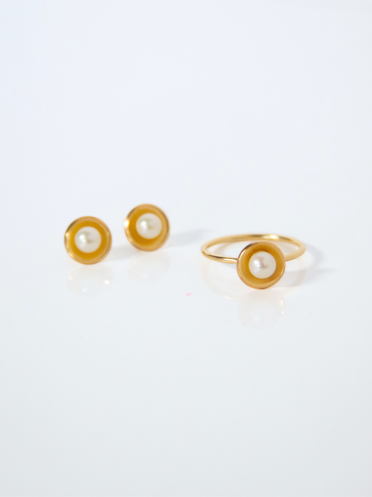 Group shot of Emma Pearl Dish Studs and matching ring, Emma Pearl Dish Ring.