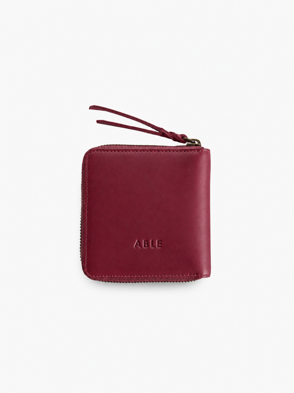 Red wallet with 'ABLE' branding on a white background. #Color_Oxblood