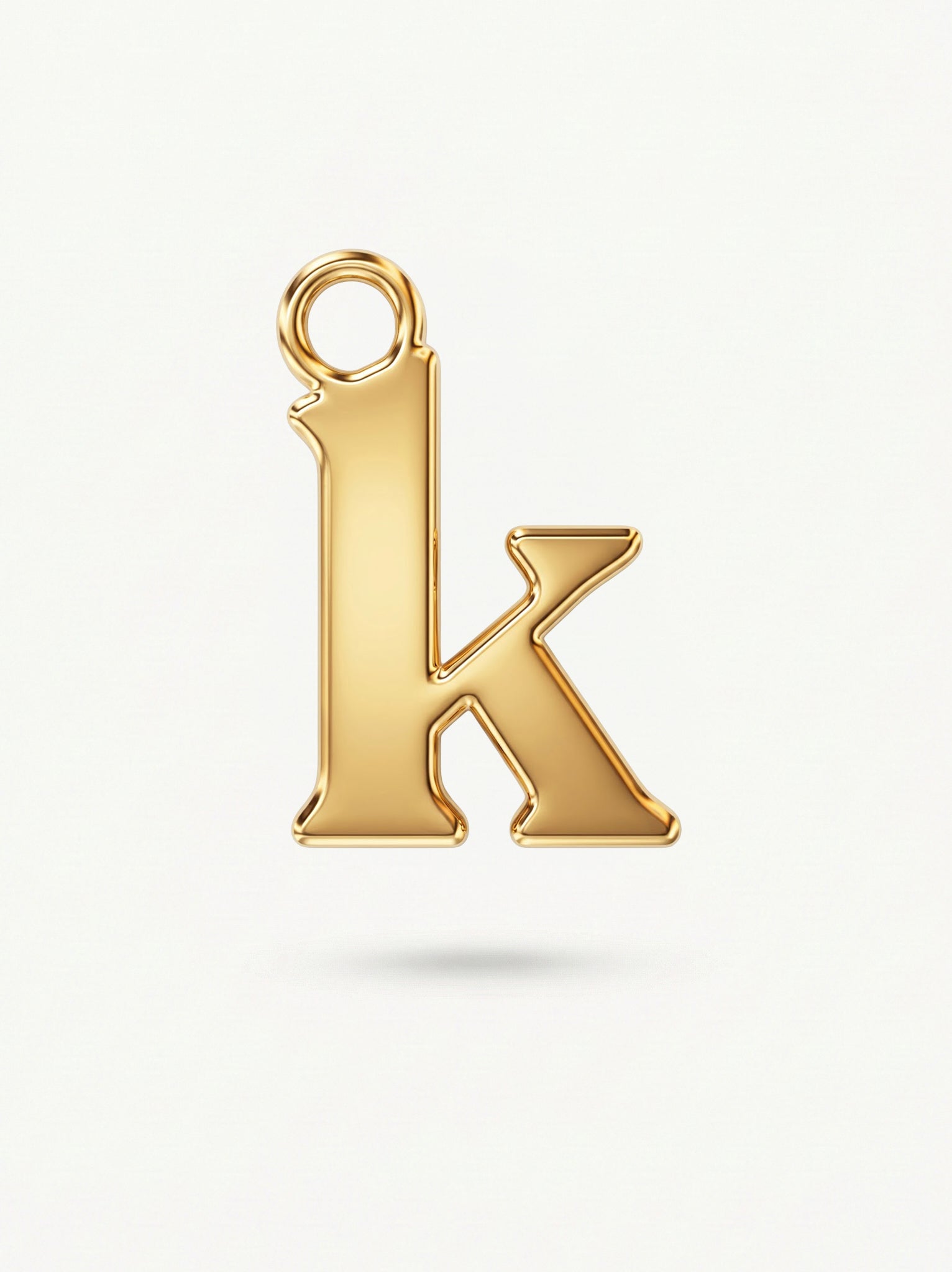 Initial Charm Gold Vermeil; Gold letter 'K' pendant on a white background