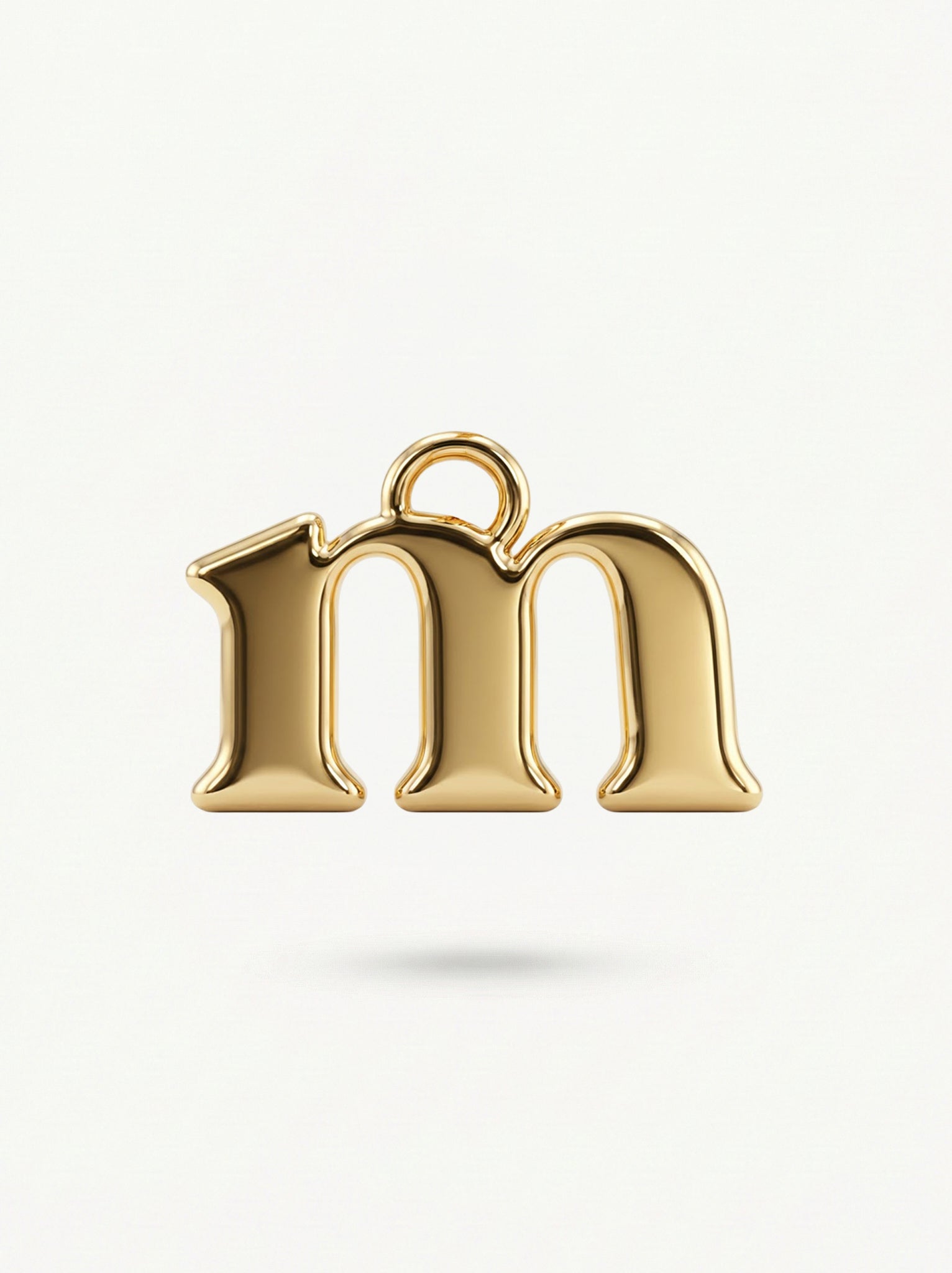 Initial Charm Gold Vermeil; Gold letter 'm' pendant on a white background