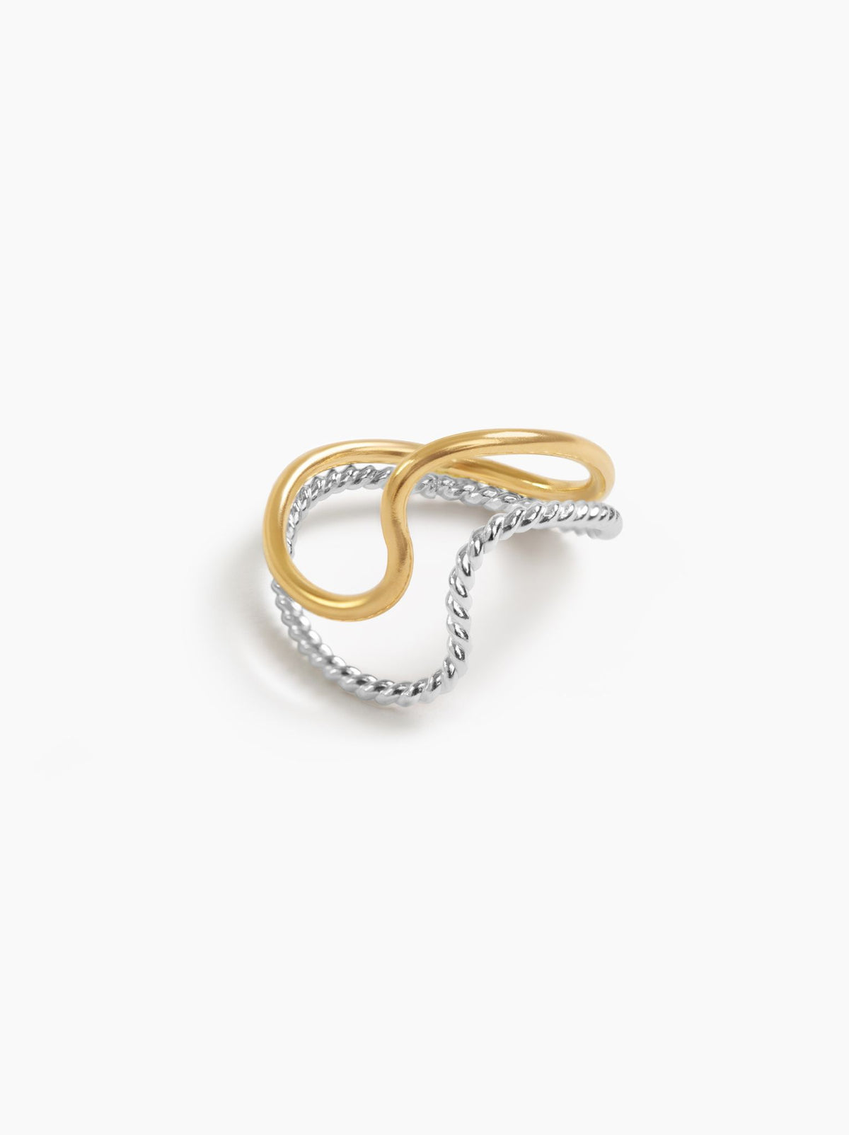 A ring with a smooth gold band and twisted textured silver band on a white background.