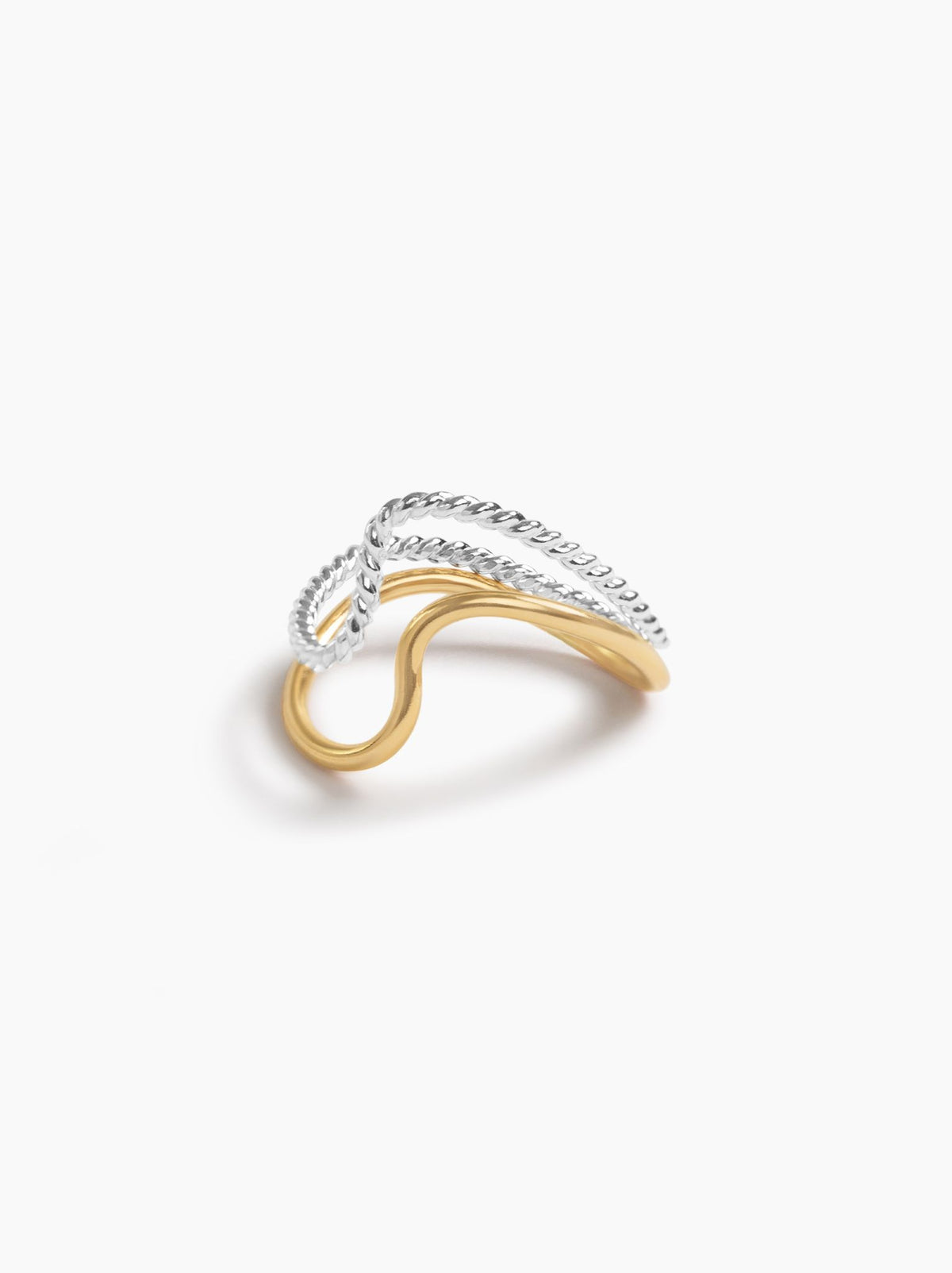 Side view of a ring with a smooth gold band and twisted textured silver band on a white background.