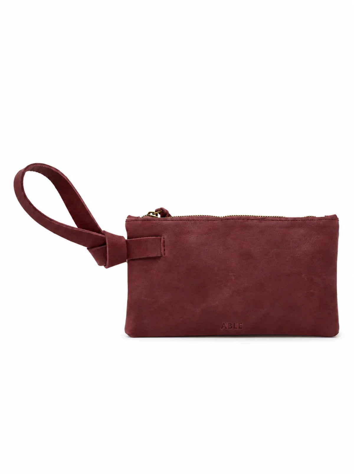 A burgundy leather wristlet clutch with a matching wrist strap and zipper pull, shown on a plain white background. #Color_Oxblood