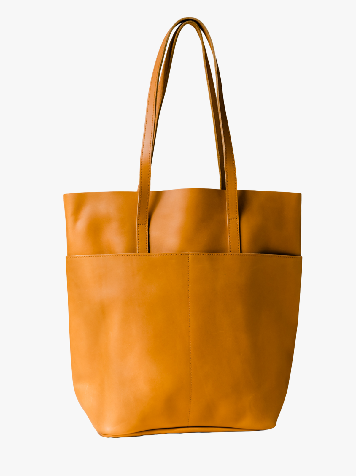A cognac leather tote bag with two shoulder straps, shown against a plain white background. #Color_Cognac