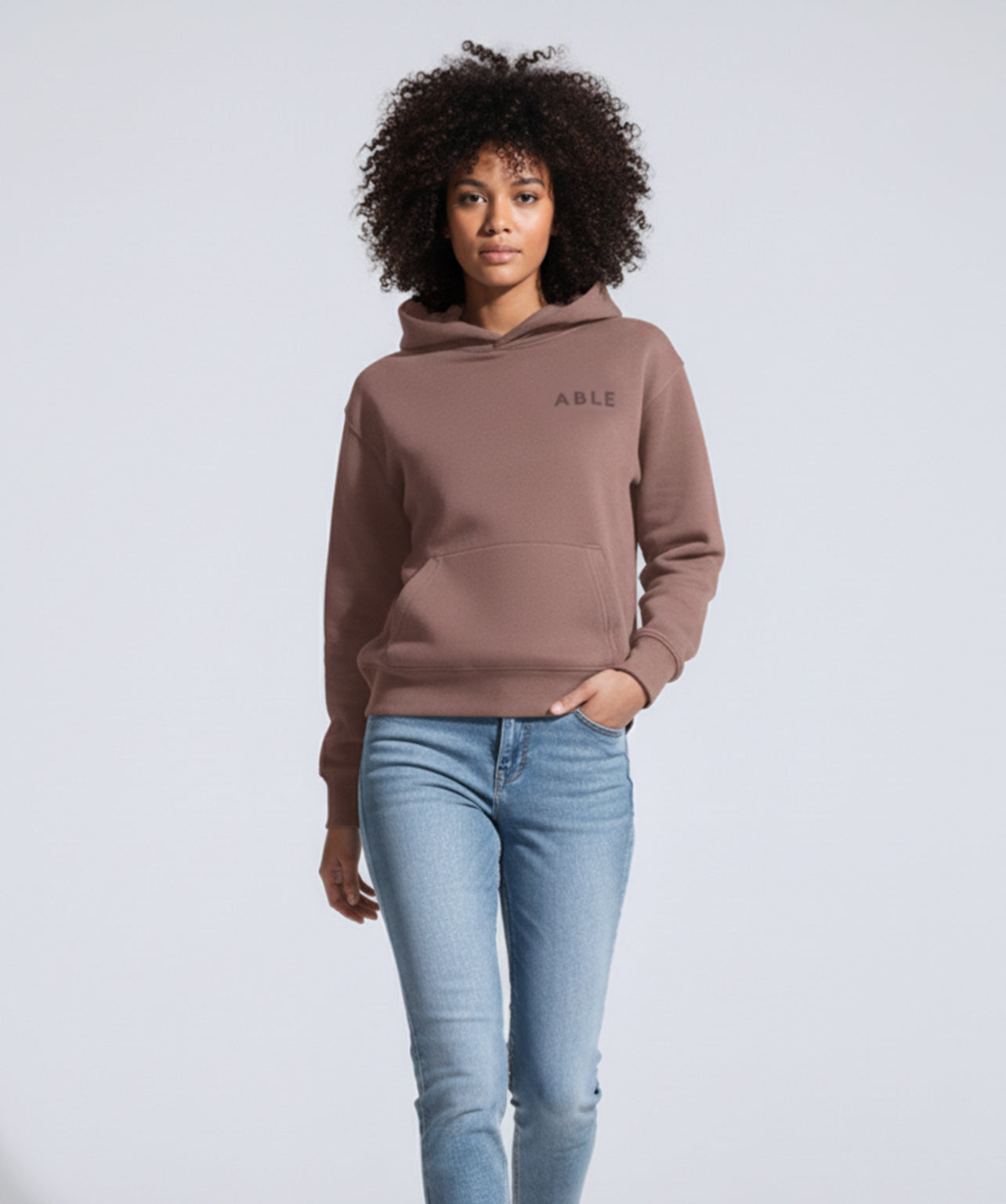 Person wearing ABLE Signature Hoodie with 'ABLE' logo and light blue jeans on a white background