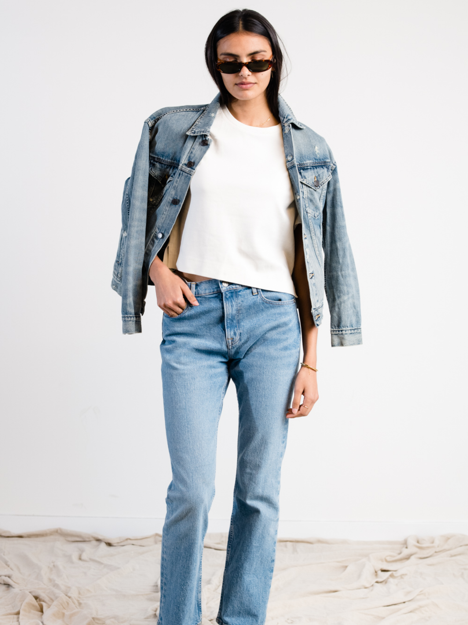 Person wearing The Merly Jacket and jeans on a plain background
