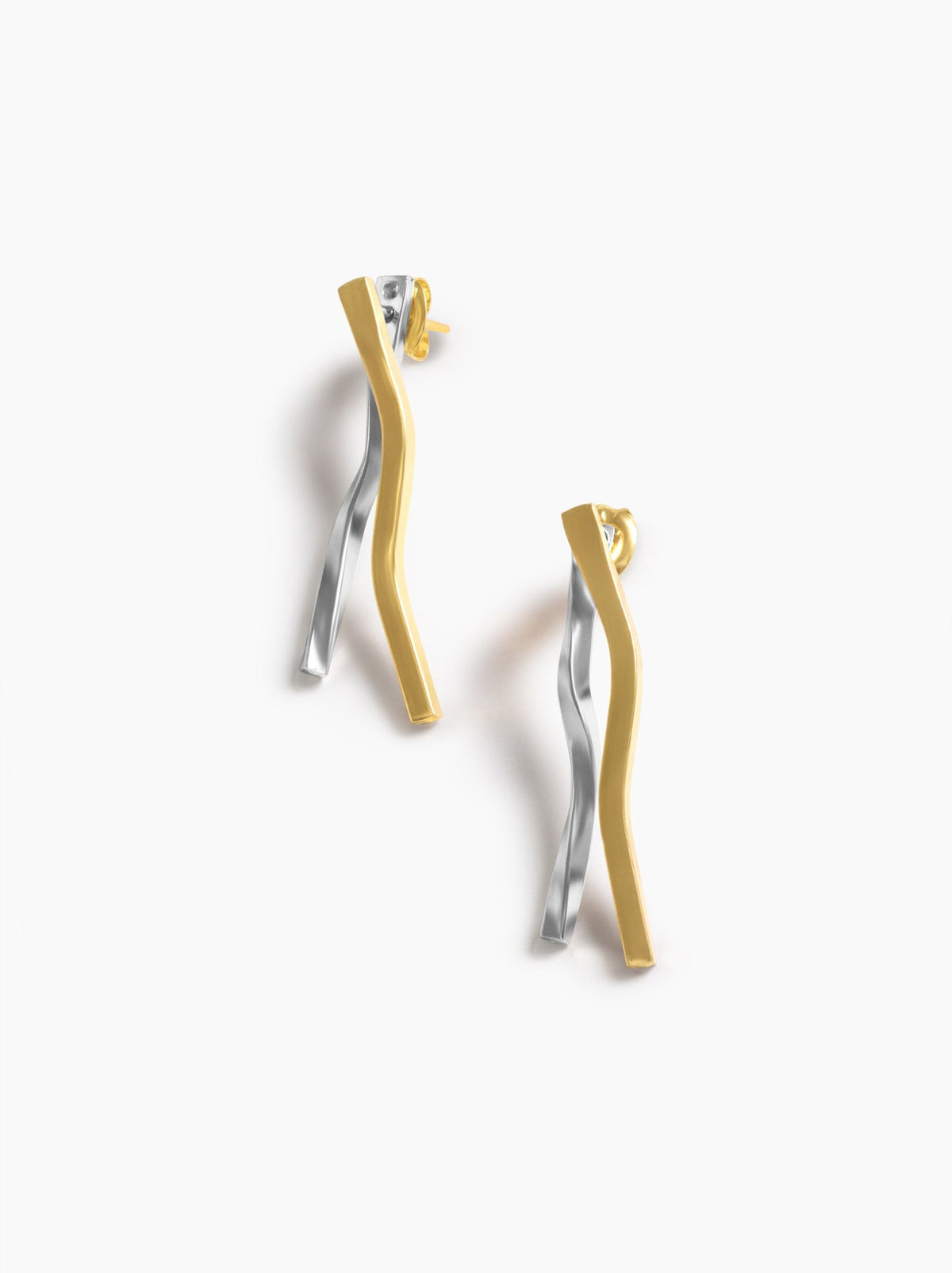 Pair of gold and silver earrings on a white background.