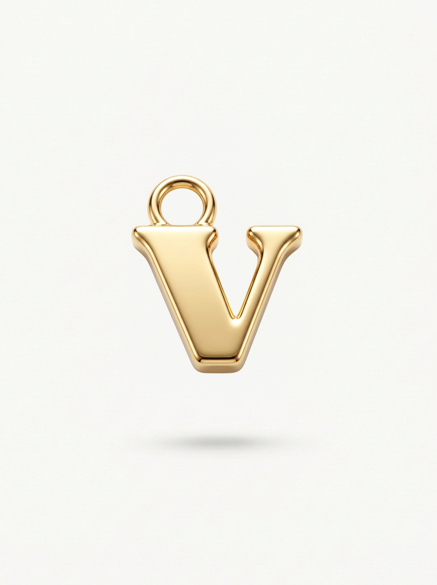 Initial Charm Gold Vermeil; Gold letter 'V' pendant on a white background