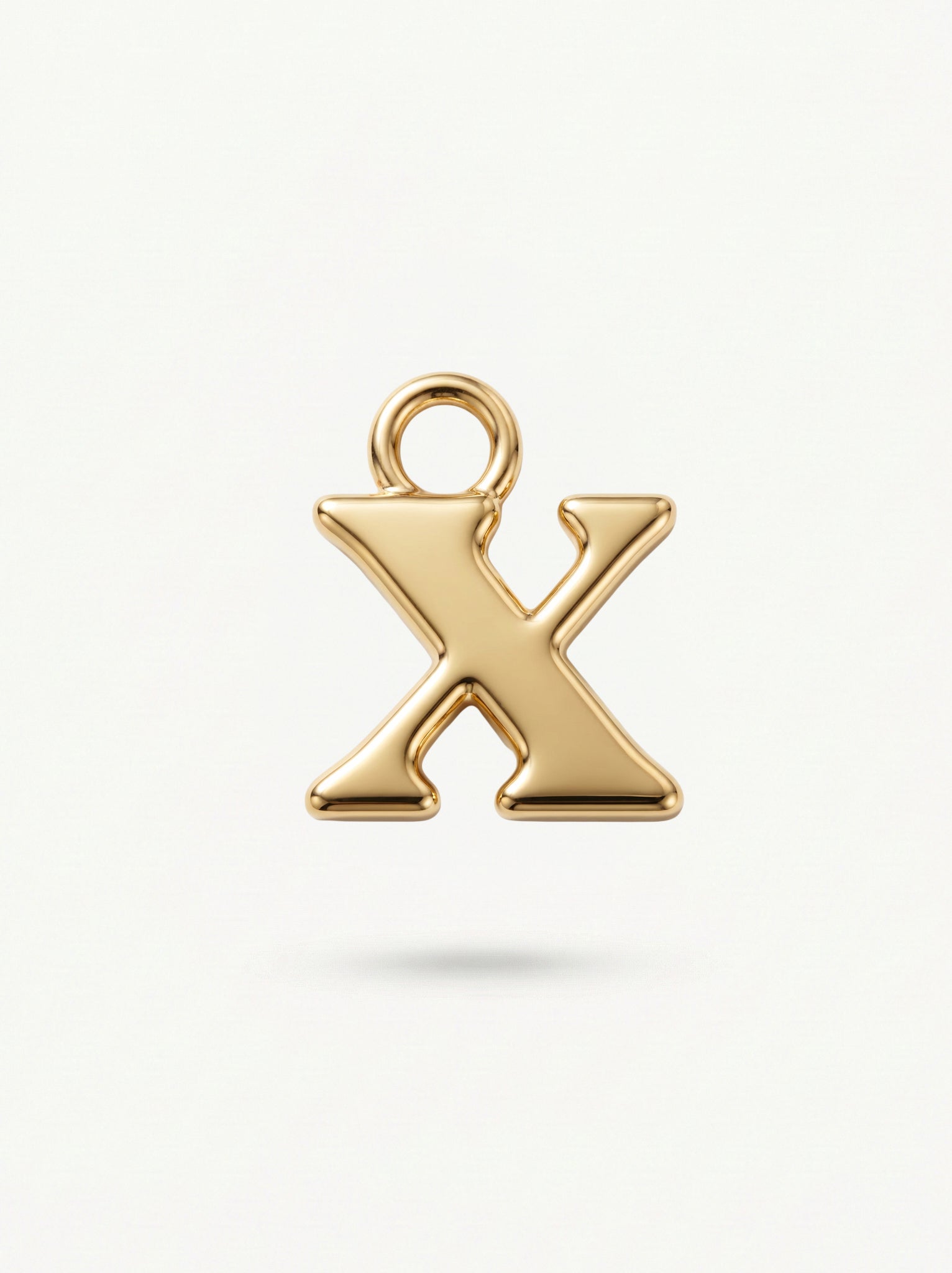 Initial Charm Gold Vermeil; Gold letter 'X' charm on a white background