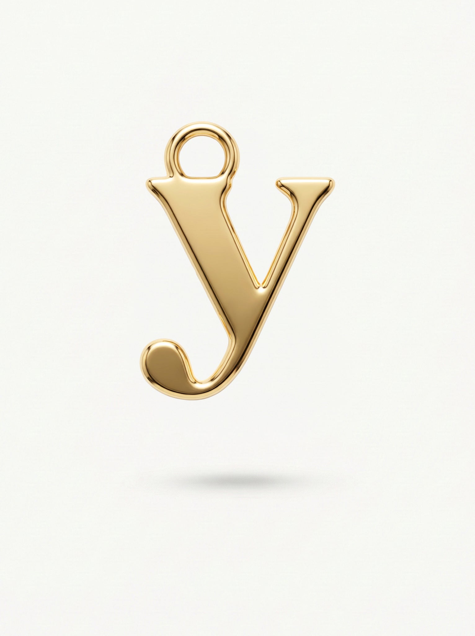 Initial Charm Gold Vermeil; Gold letter 'y' pendant on a light background
