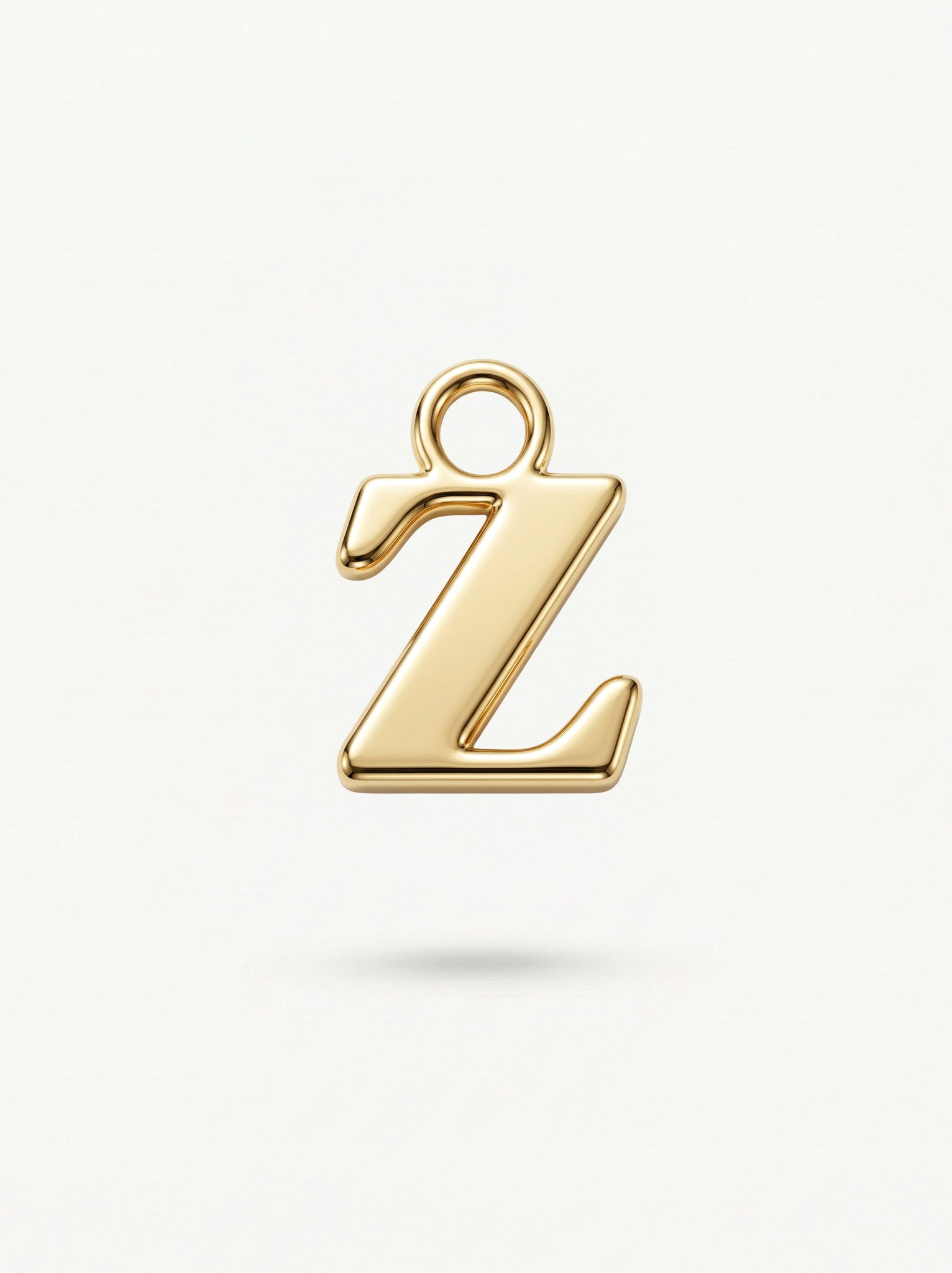 Initial Charm Gold Vermeil; Gold letter 'Z' pendant on a light background