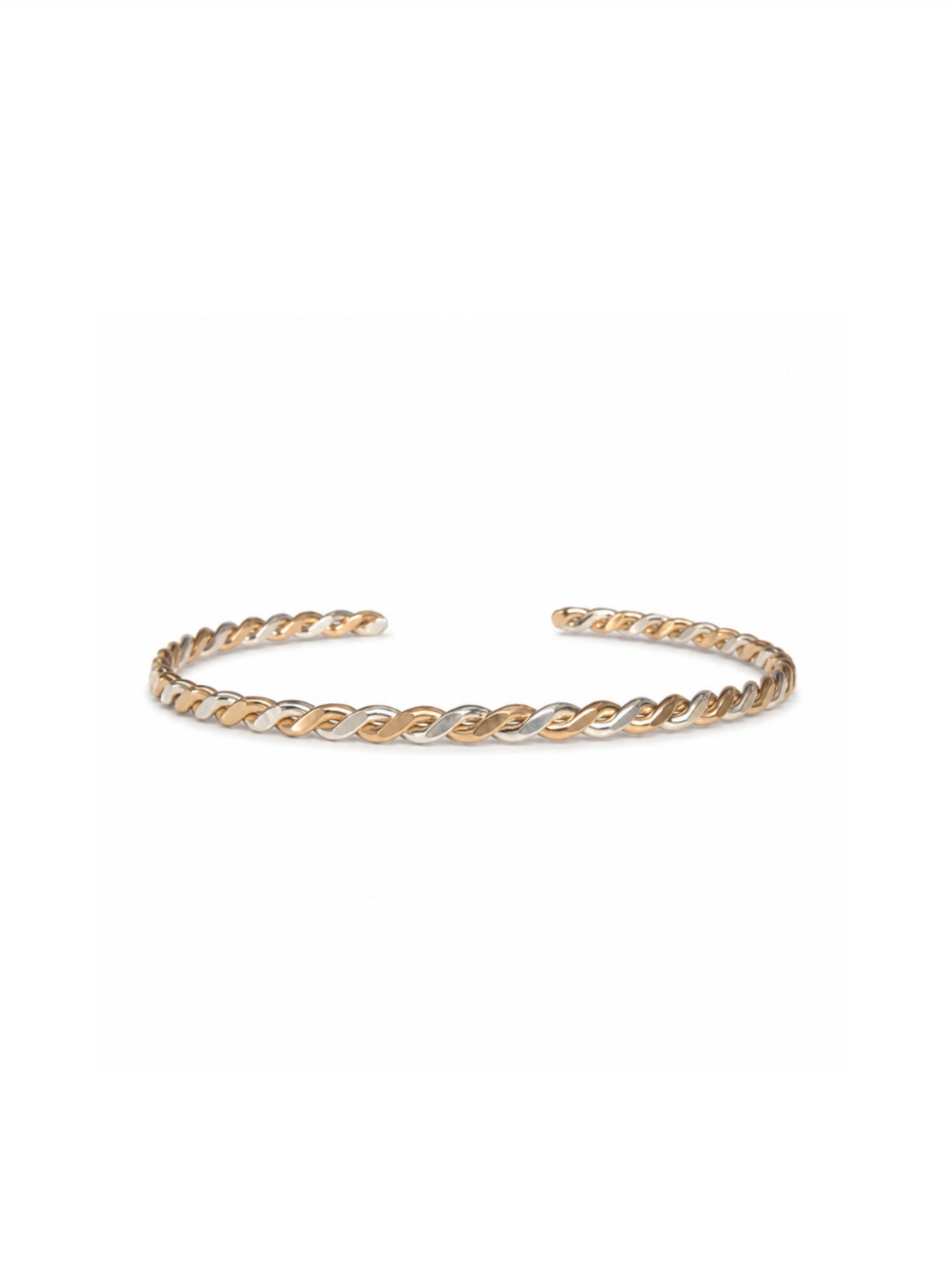Front view of braided gold and silver cuff bracelet on white background.