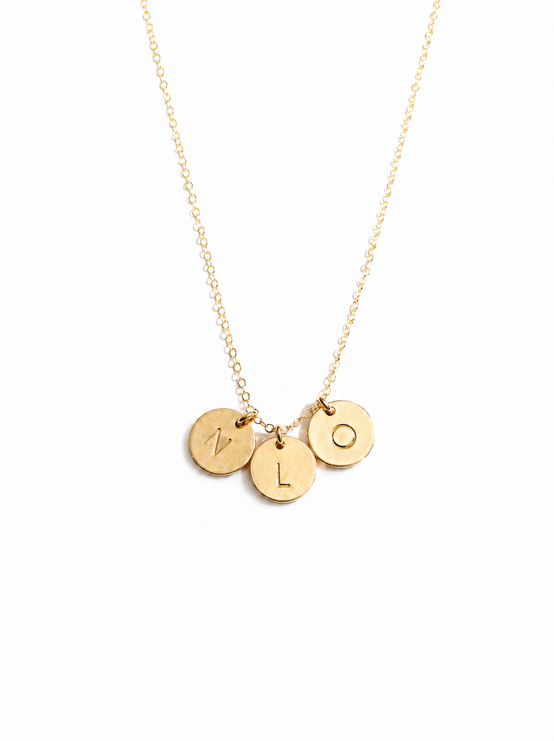 A gold chain necklace with three small round disc charms engraved with the letters 'N', 'L', and 'O', shown on a plain white background. #Color_14k Gold