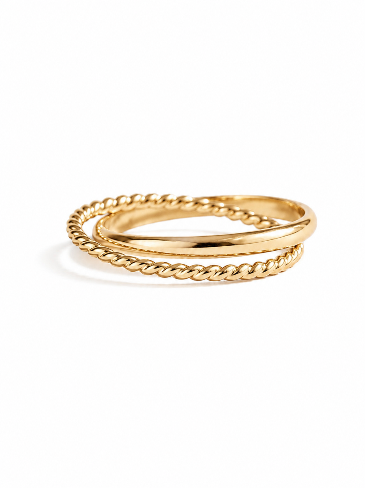 Gold ring with a textured band and twisted band interlocked on a white background.